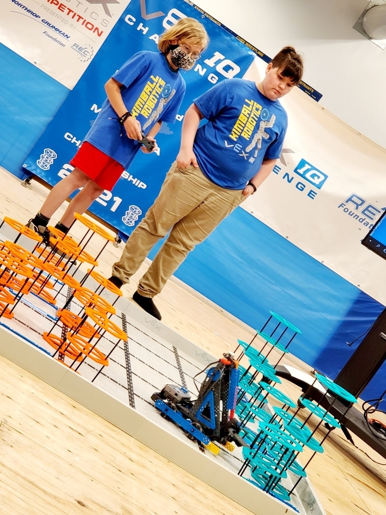 Students watch robot go through obstacle course