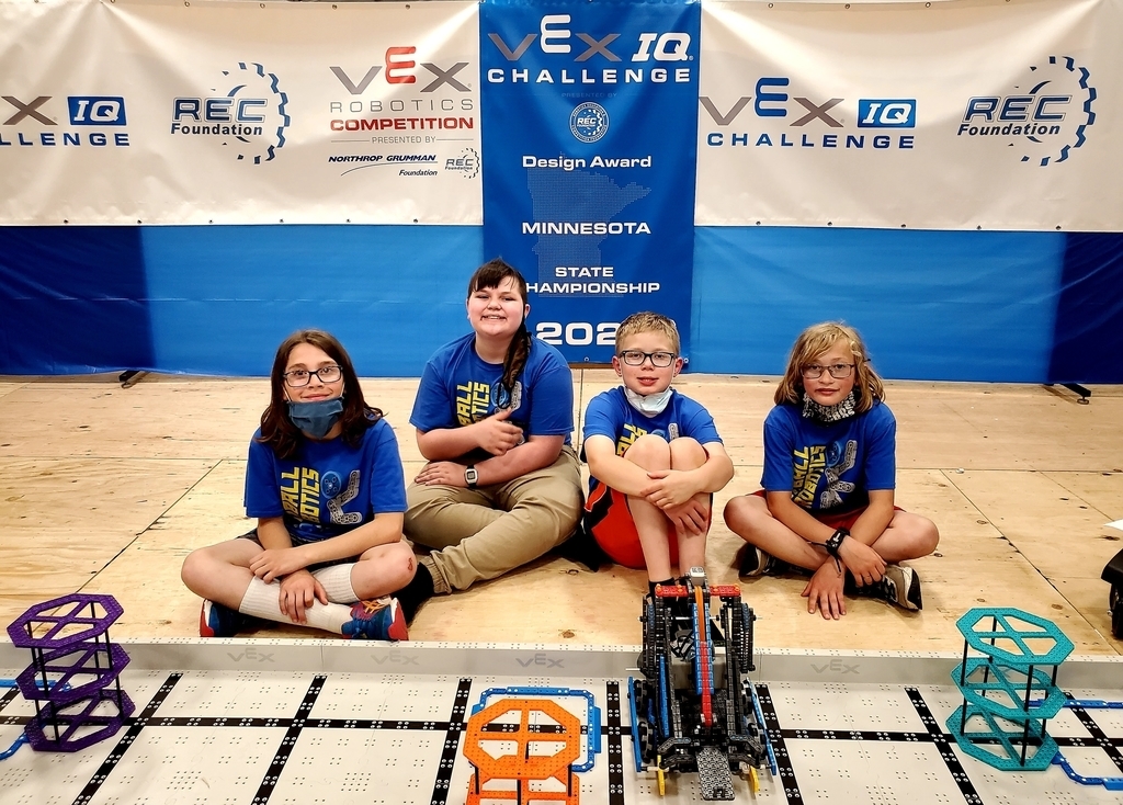 Students pose with robots